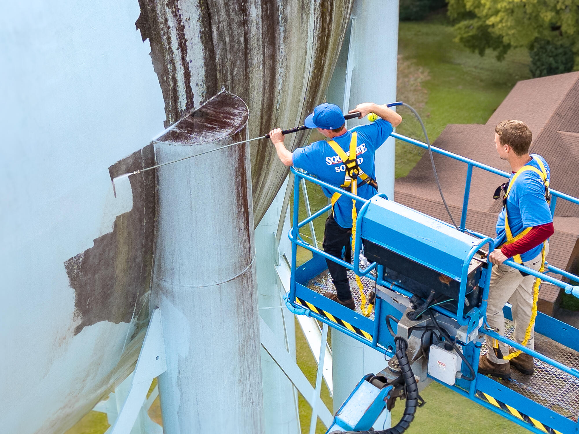 Drone footage of water tank pressure washing
